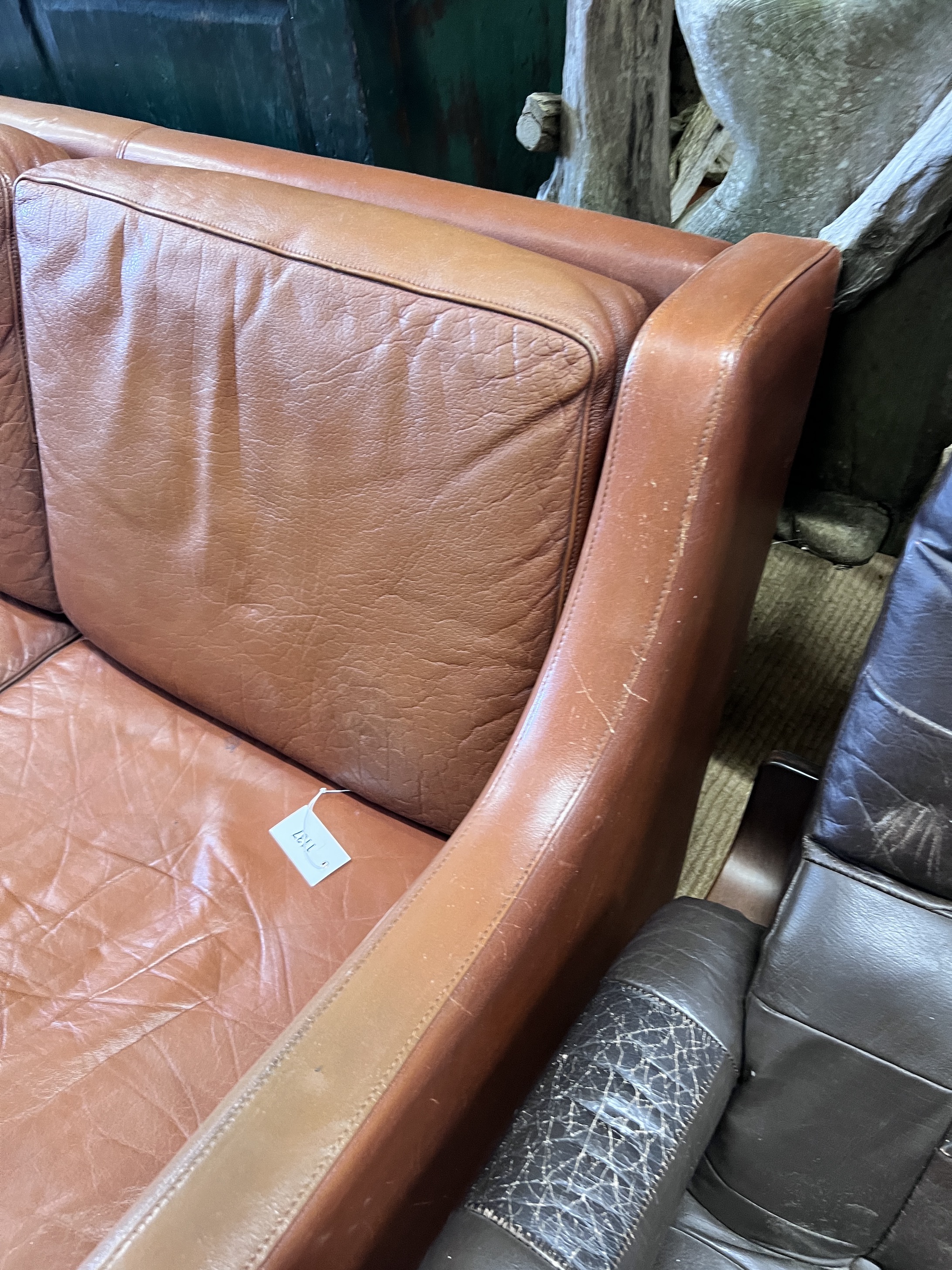 A mid century Danish tan leather sofa in the style of Borge Mogensen, length 182cm